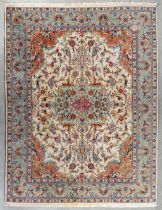 An Oriental hand-made carpet, Tabriz. (L:363 x W:275 cm)