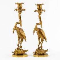 A pair of candelabra, gilt bronze decorated with a heron, tortoise and fish, circa 1900. (H:37 x D:1
