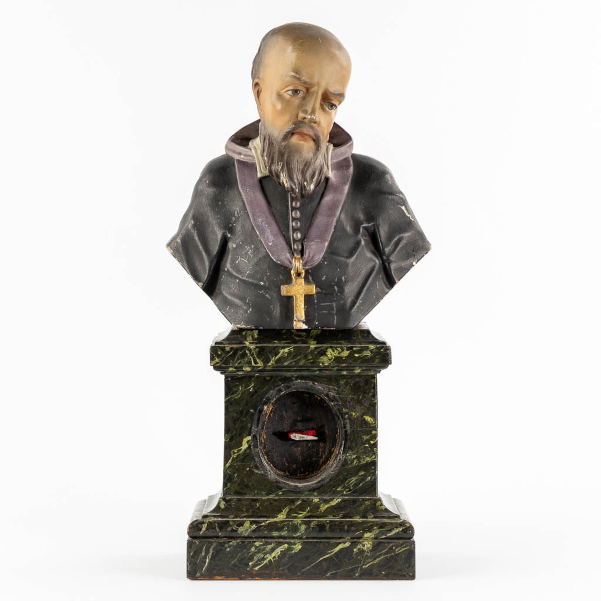 An antique reliquary buste of a saint. Sculptured and patinated wood. 19th C. (L:14 x W:25 x H:50 cm