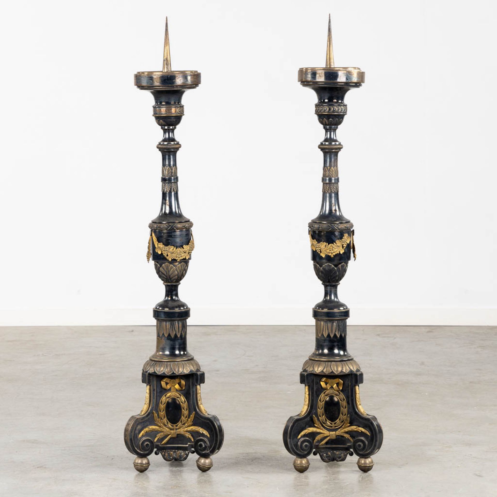A pair of Church Candlesticks, silver- and gold-plated metal. 19th C. (H:120 cm)