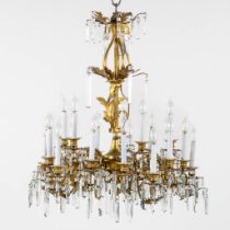 A large chandelier, gilt bronze mounted with glass crystals. (H:95 x D:82 cm)
