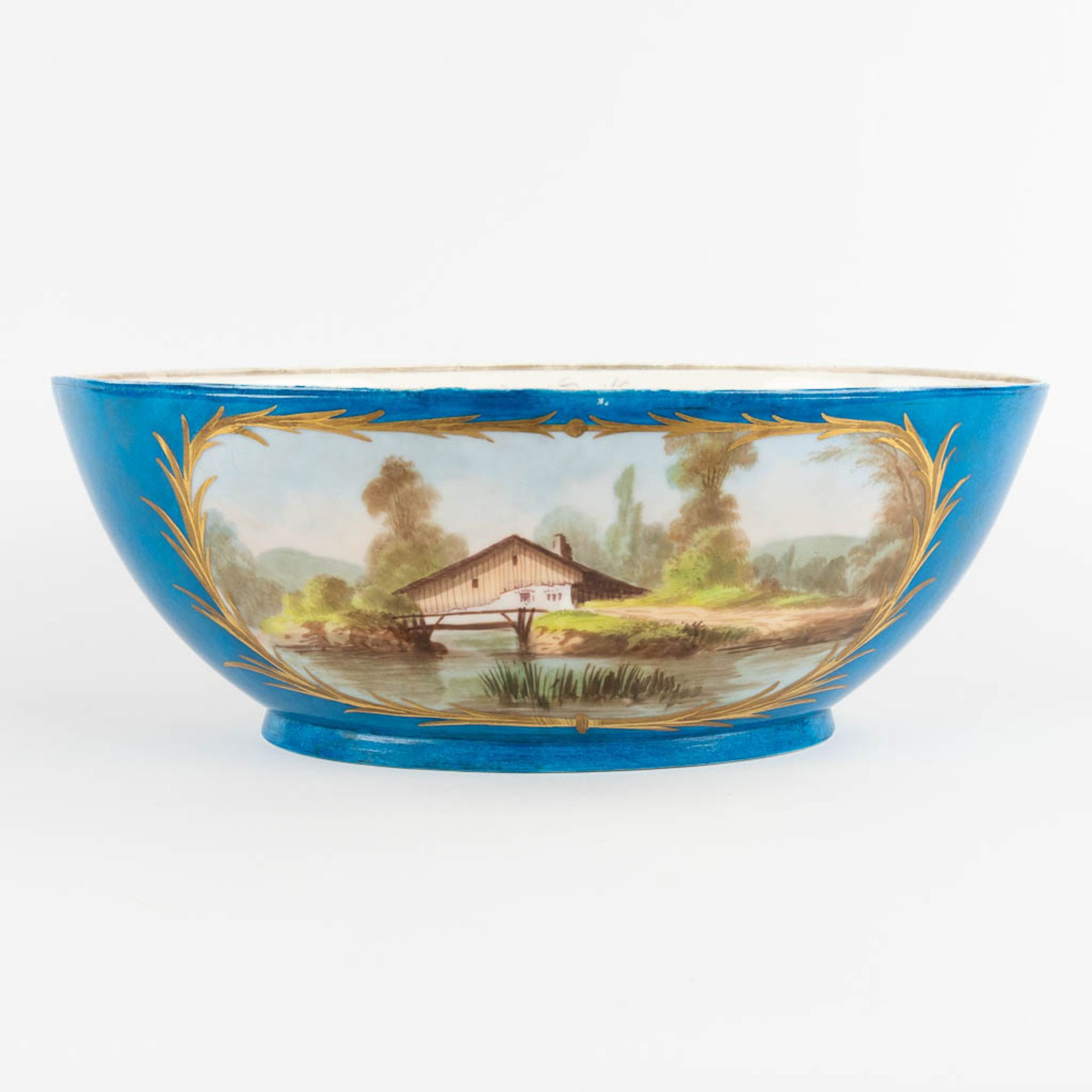 A large bowl, blue glaze with hand-painted decor, probably Limoges. (L:24 x W:39 x H:14 cm) - Image 5 of 12