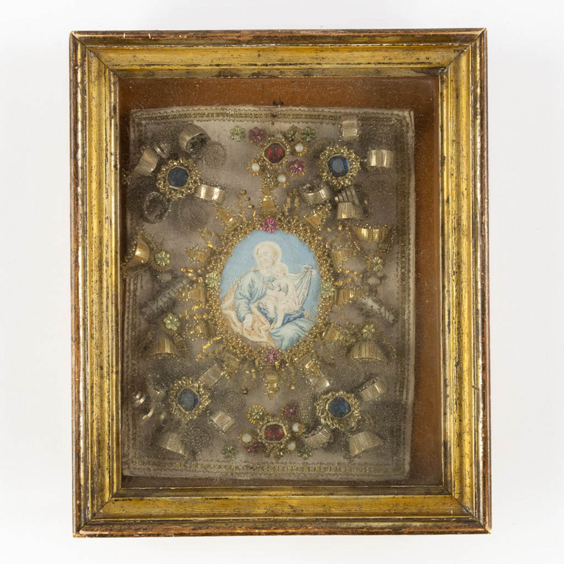 An antique frame with an image of Joseph with child, cabochons and decorations. 19th C. (W:21 x H:25