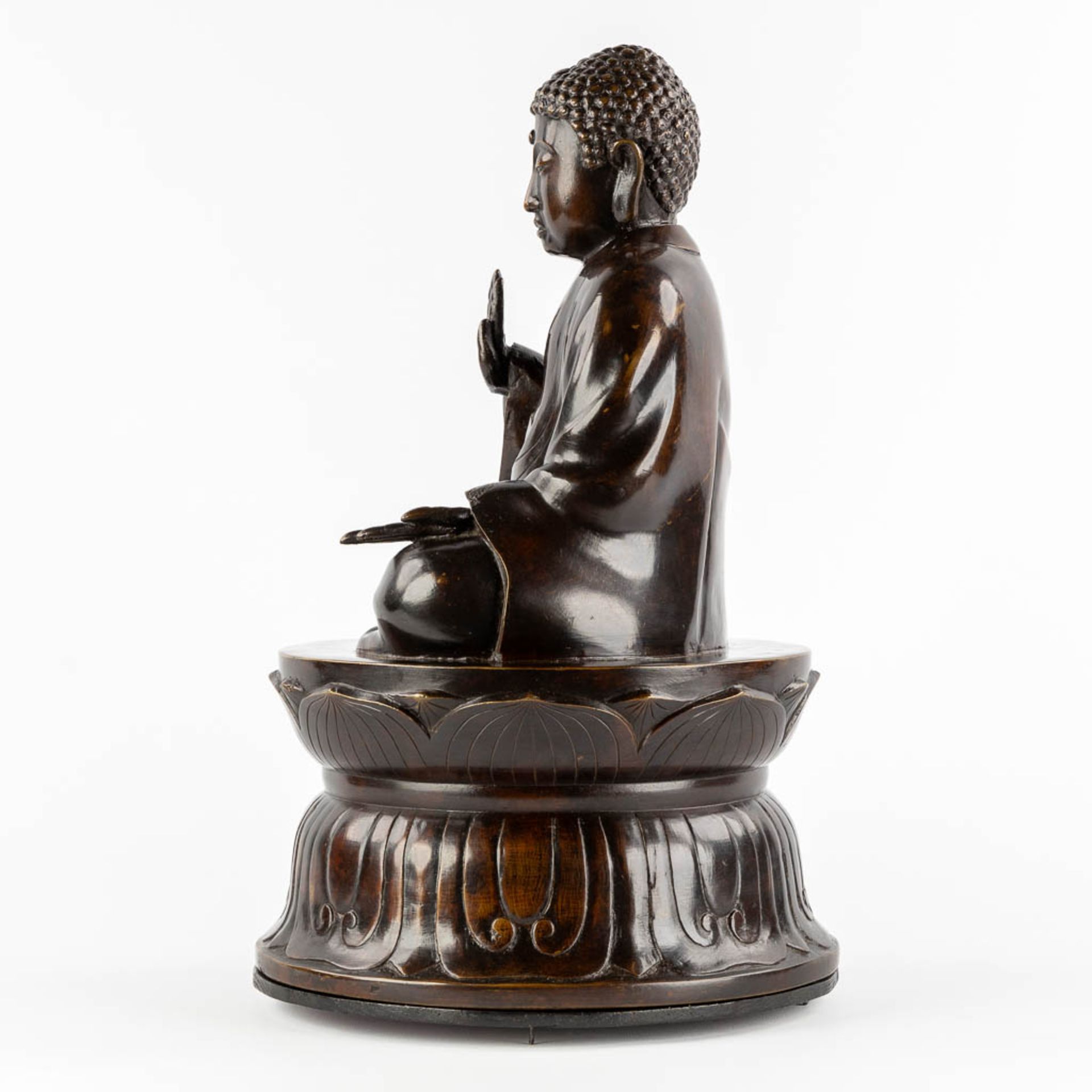 A Buddha seated on a lotus flower, patinated bronze. (H:50 x D:30 cm) - Image 4 of 10