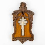 A mother-of-pearl crucifix mounted in a sculptured wood frame signed Ed. Engels. 19th C. (W:16 x H:2