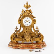An antique mantle clock, gilt bronze in a Louis XVI style, decorated with ram's heads. Circa 1880. (