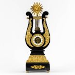 A Lyre mantle clock, gilt bronze and marble. 19th C. (L:13 x W:22 x H:61 cm)