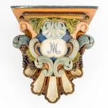 A polychrome wood-sculptured wall-mounted stand for a statue, 18th/19th C. (L:25 x W:47 x H:50 cm)