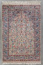 An Oriental hand-made carpet, wool and silk (L:185 x W:124 cm)