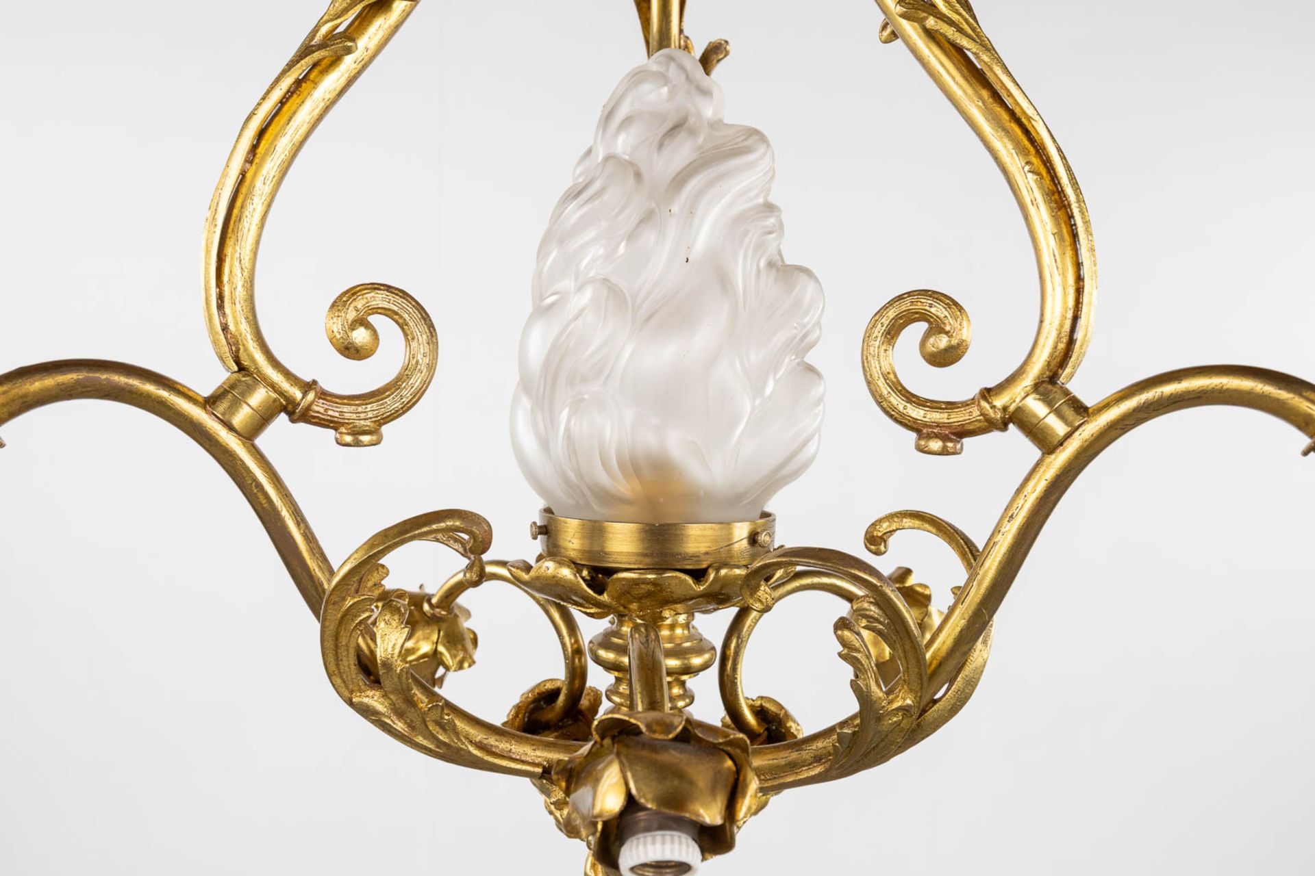 A chandelier, bronze with glass shades and a flambeau, decorated with Satyr figurines. (H:88 x D:54 - Image 7 of 13