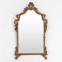 An Italian wood-sculptured and gilt mirror, 19th C. (W:76 x H:135 cm)