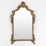 An Italian wood-sculptured and gilt mirror, 19th C. (W:76 x H:135 cm)