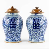 A pair of Chinese vases with a blue-white decor and a Double Xi-sign. 19th/20th C. (H:41 x D:26 cm)