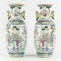 A pair of Chinese vases, decorated with figurines, fauna and flora. 19th/20th C. (H:57 x D:25 cm)