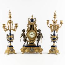 A three-piece mantle garniture clock and candelabra, Empire style, circa 1970. (L:21 x W:35 x H:63 c