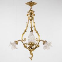 A chandelier, bronze with glass shades and a flambeau, decorated with Satyr figurines. (H:88 x D:54