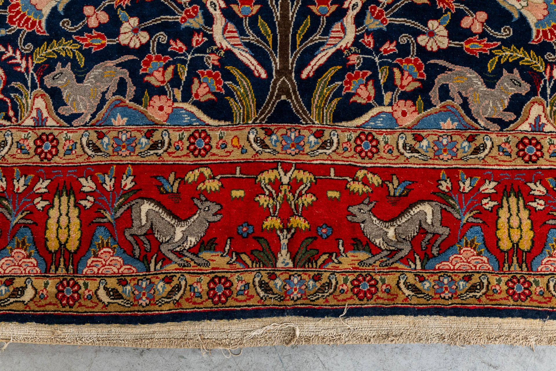 An Oriental, hand made carpet decorated with &quot;Fauna and Flora&quot;. (L: 320 x W: 223 cm) - Image 5 of 9
