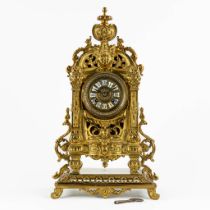 A mantle clock, gilt bronze. 20th C. (L:16 x W:25 x H:45 cm)