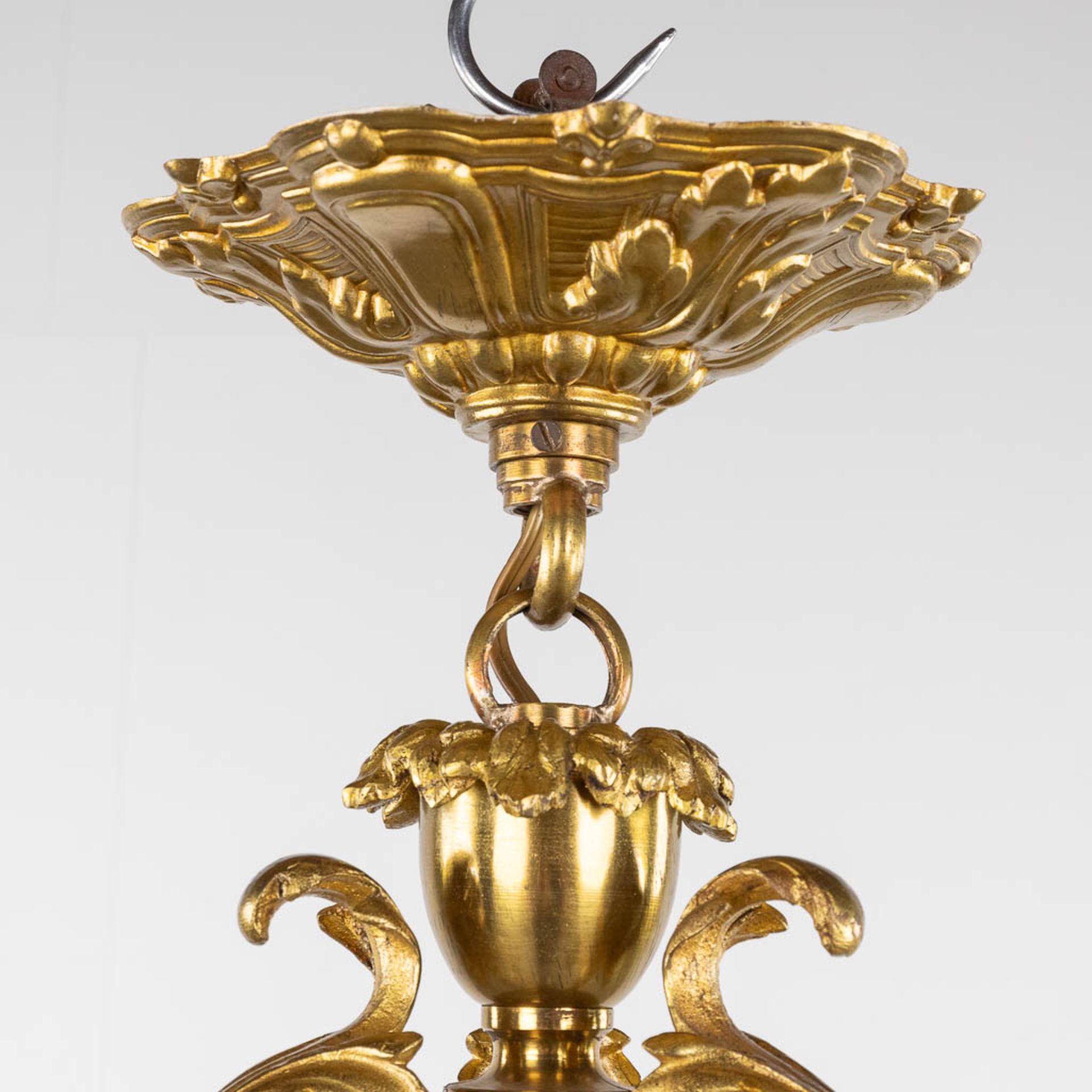 A chandelier, bronze with glass shades and a flambeau, decorated with Satyr figurines. (H:88 x D:54 - Image 4 of 13