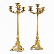 A pair of candelabra, gilt bronze in a Louis XVI style. 19th C. (L:17 x W:17 x H:49 cm)