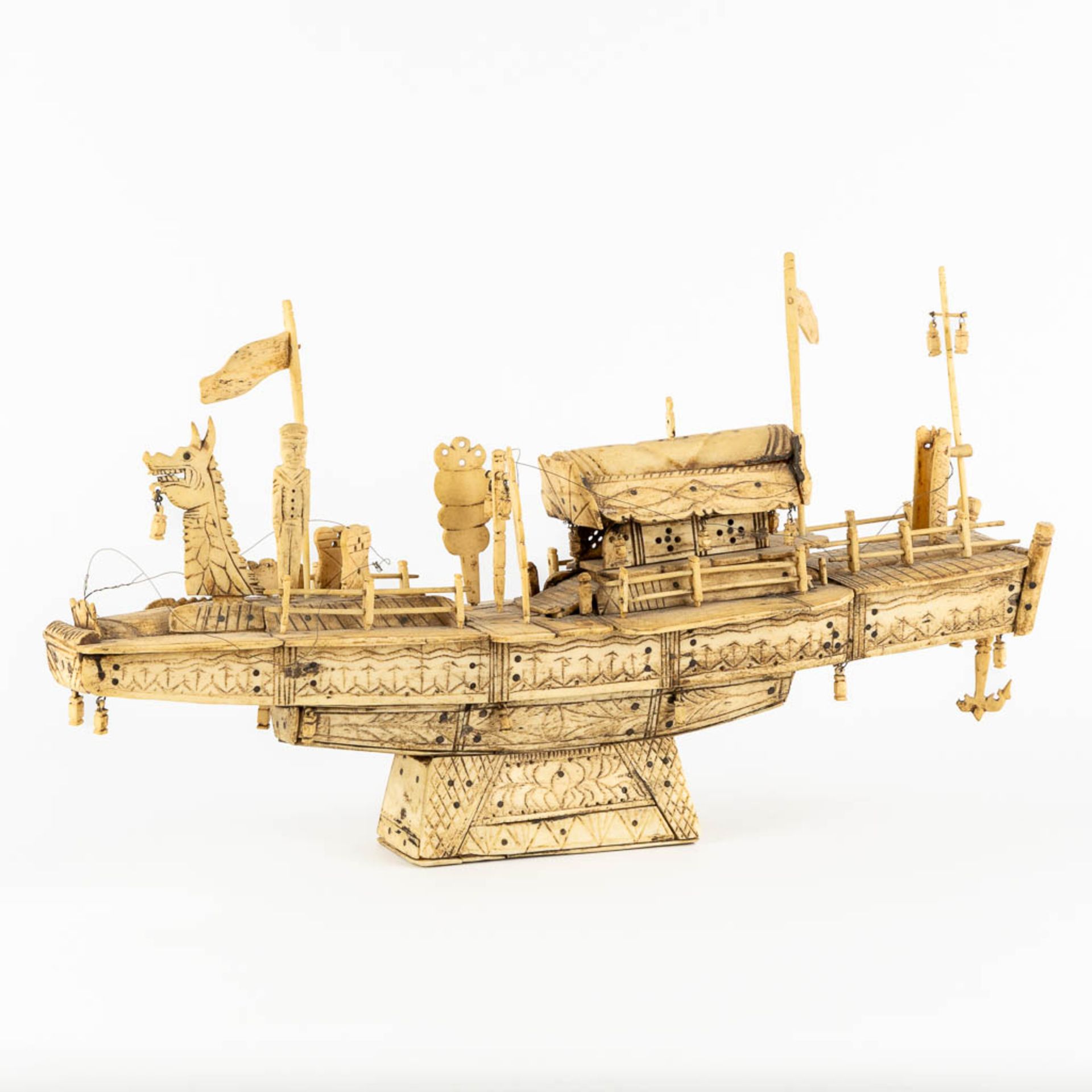 An antique Chinese model of a ship, sculptured bone. Circa 1900. (L:13 x W:50 x H:28 cm)