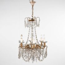 A chandelier, bronze mounted with glass. Circa 1920. (H:80 x D:56 cm)