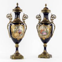 Sèvres, a pair of bronze mounted hand-painted vases, signed Garnier. Circa 1900. (L:16 x W:19 x H:52