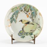 A small Chinese plate with a bird decor, Guangxu mark. (H:4 x D:18 cm)