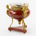 A Table Centerpiece on high feet, gilt and red lacquered bronze in a transitional style. With an etc