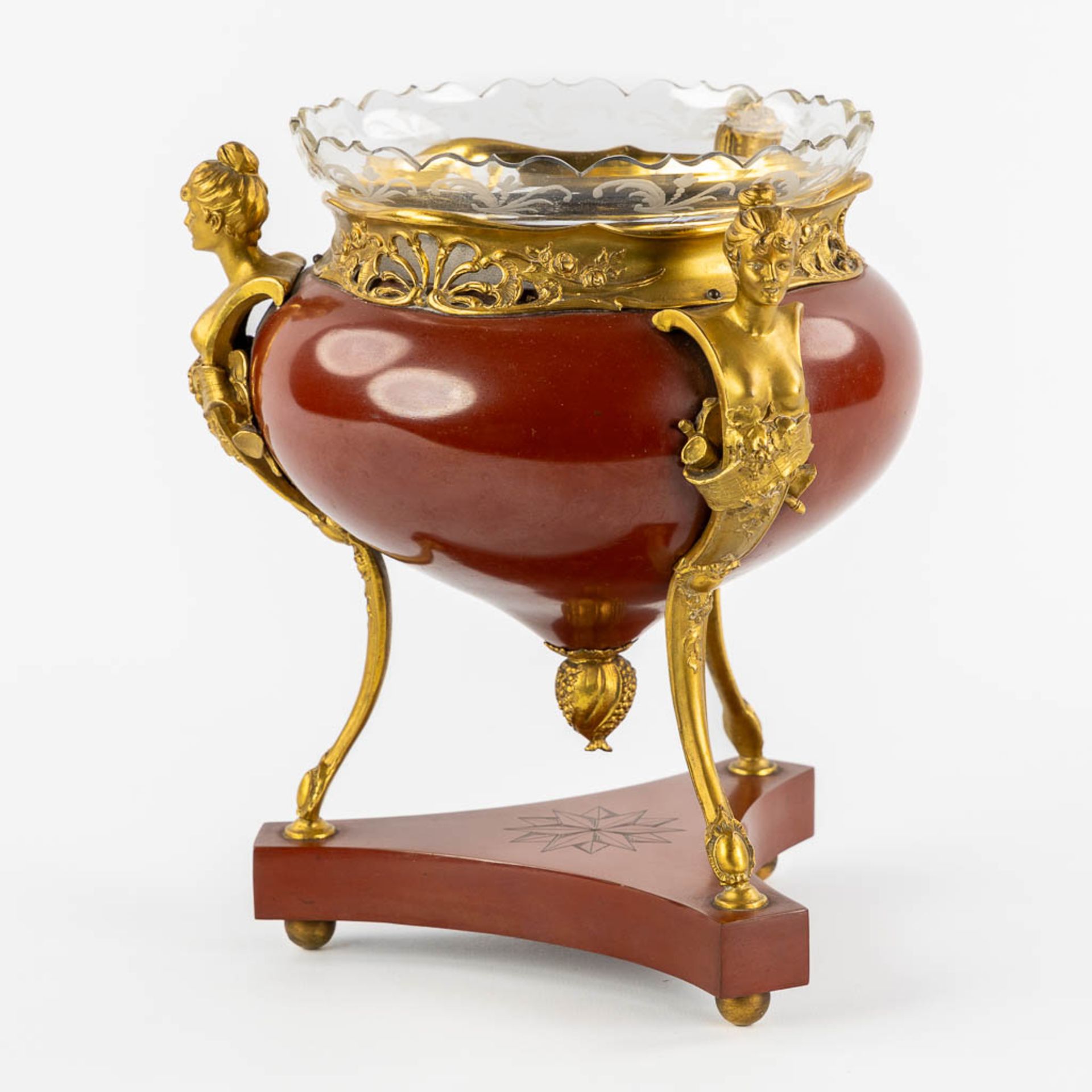A Table Centerpiece on high feet, gilt and red lacquered bronze in a transitional style. With an etc