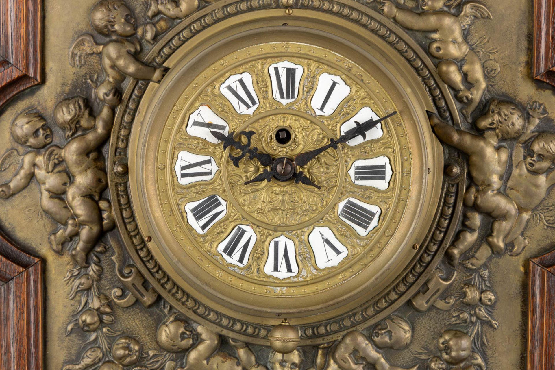 A wall-mounted clock, sculptured oak and repousse copper, decorated with putti and angels. 19th C. ( - Image 5 of 8