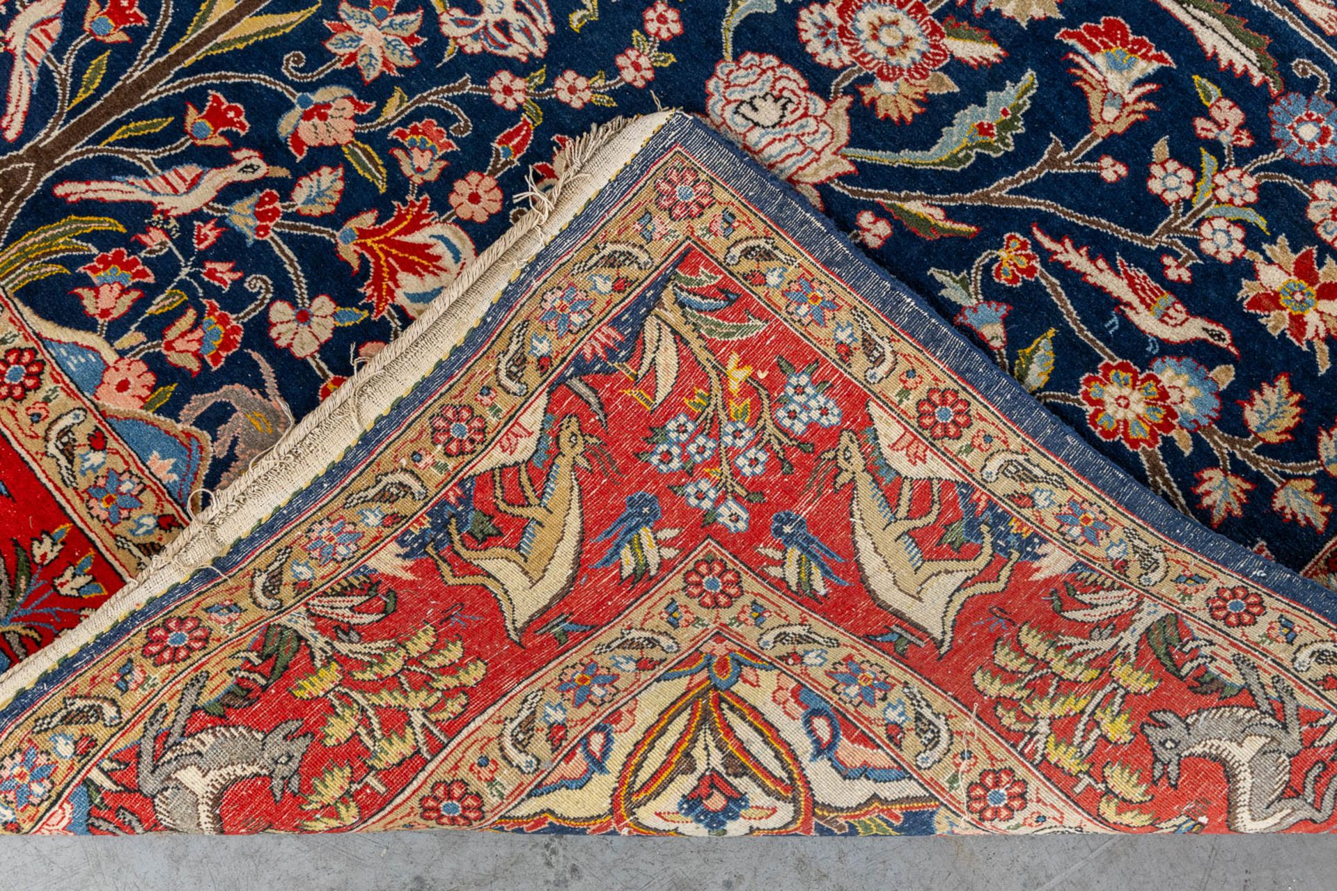 An Oriental, hand made carpet decorated with &quot;Fauna and Flora&quot;. (L: 320 x W: 223 cm) - Image 9 of 9