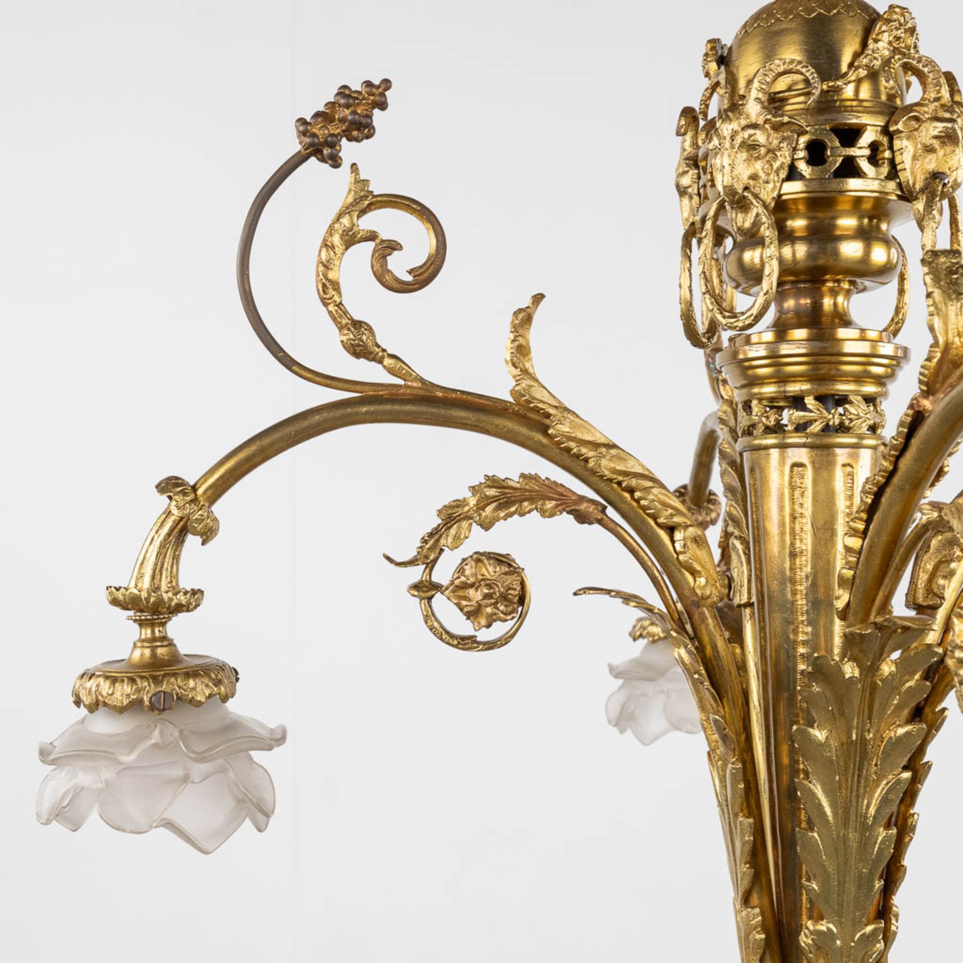 A chandelier, bronze finished with ram's heads, Louis XVI style. (H:93 x D:66 cm) - Image 9 of 13