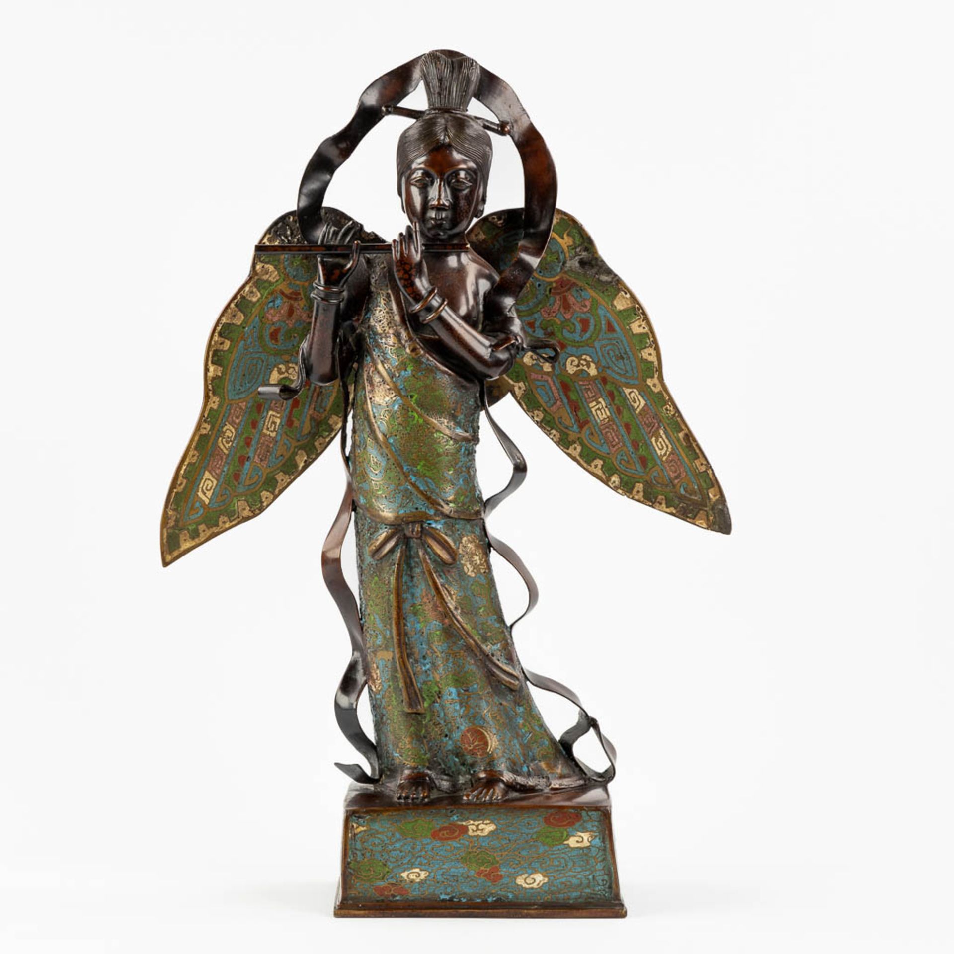 An Oriental figurine of an Angel with a flute, Champslevé bronze. (L:15 x W:35 x H:53 cm)