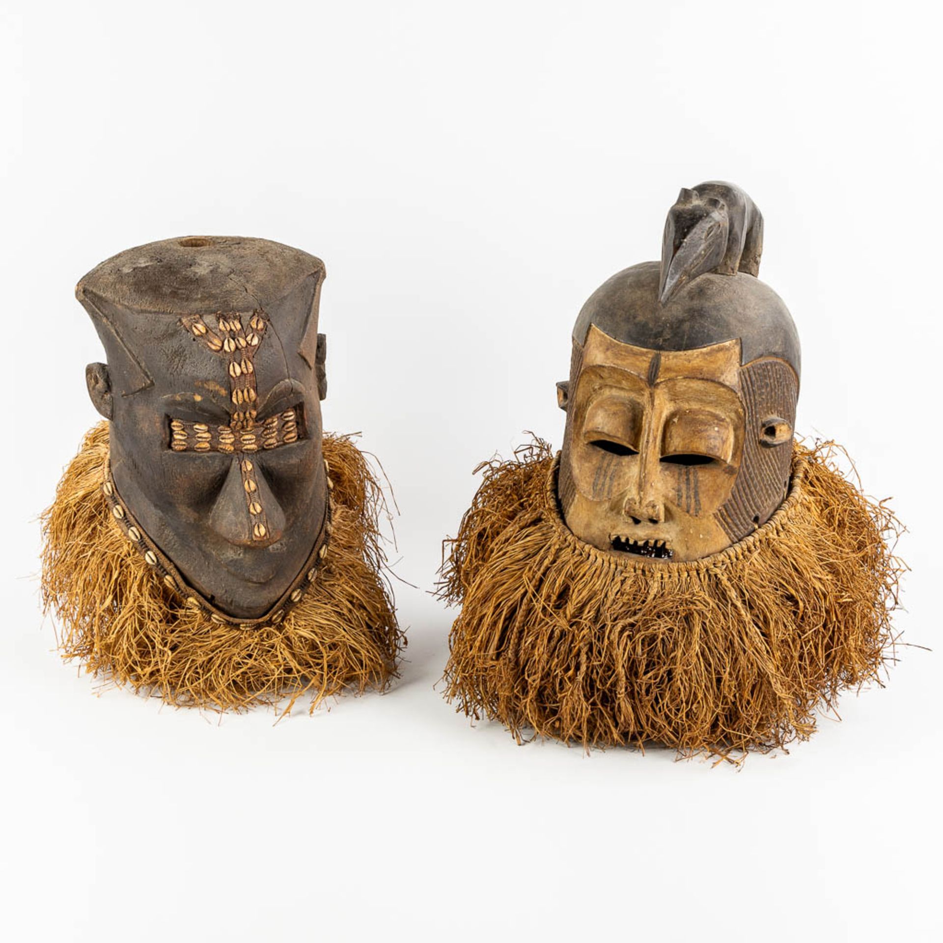 Suku Tribe, two decorative African masks. Wood and straw. (L:44 x W:40 x H:48 cm)