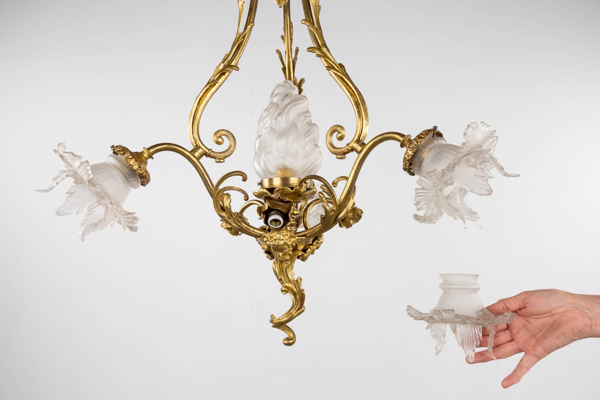 A chandelier, bronze with glass shades and a flambeau, decorated with Satyr figurines. (H:88 x D:54 - Image 12 of 13