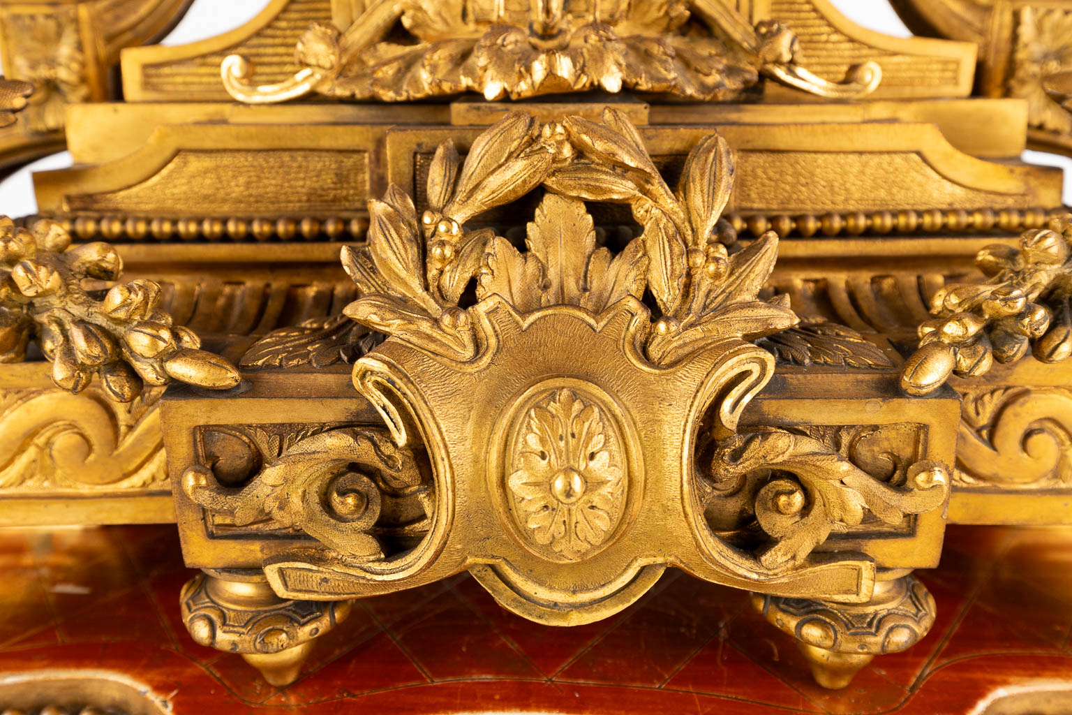 An antique mantle clock, gilt bronze in a Louis XVI style, decorated with ram's heads. Circa 1880. ( - Image 16 of 18
