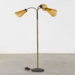 A mid-century floorlamp, cast-iron, brass and acrylic. (H:120 x D:73 cm)