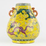 A large yellow Chinese vase with a dragon decor, Kangxi mark, 19th C. (H:47 x D:37 cm)