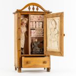 Armand Marseille, a doll with attributes stored in a faux bamboo wardrobe. Circa 1900. (L:16 x W:35 