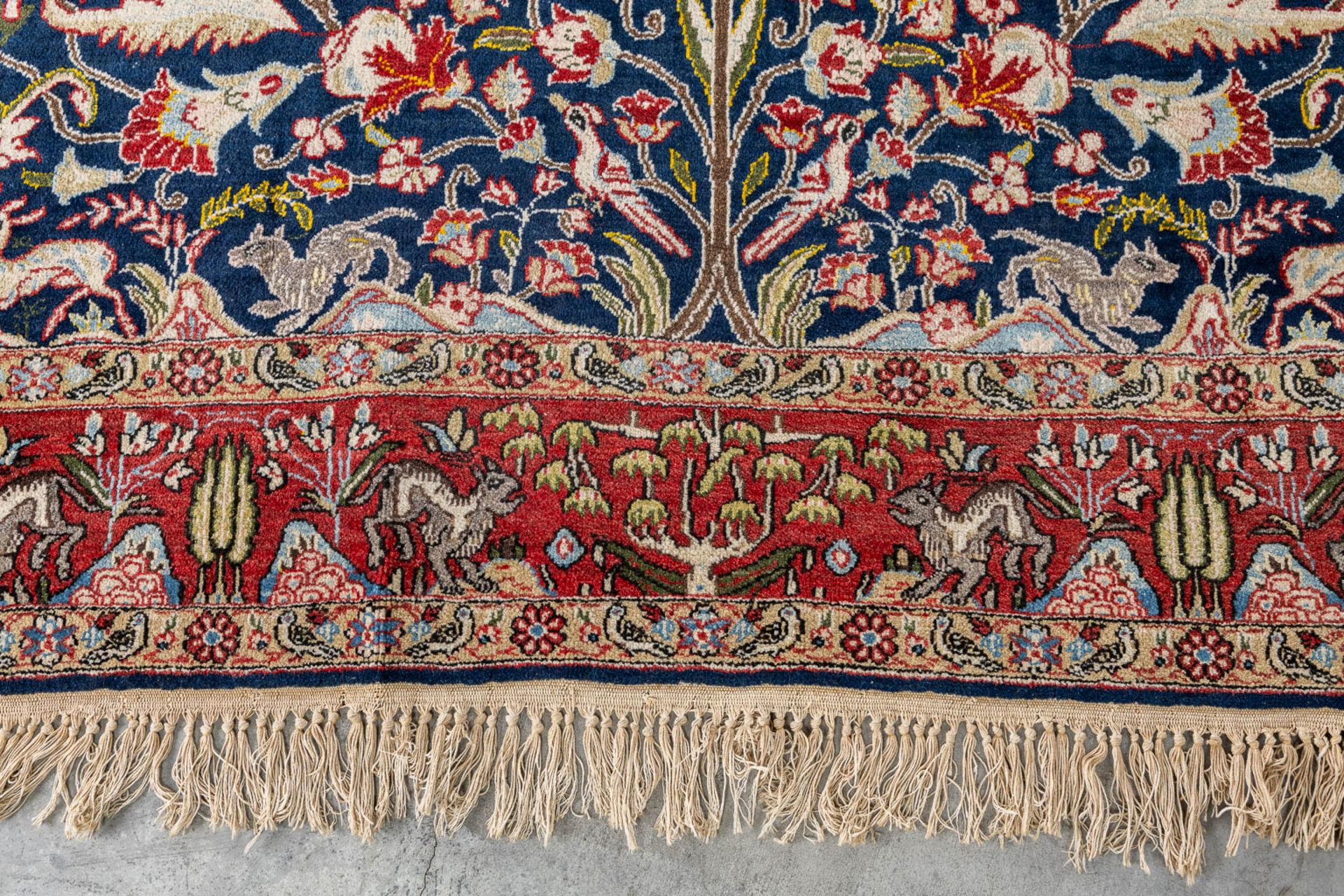 An Oriental, hand made carpet decorated with &quot;Fauna and Flora&quot;. (L: 320 x W: 223 cm) - Image 7 of 9