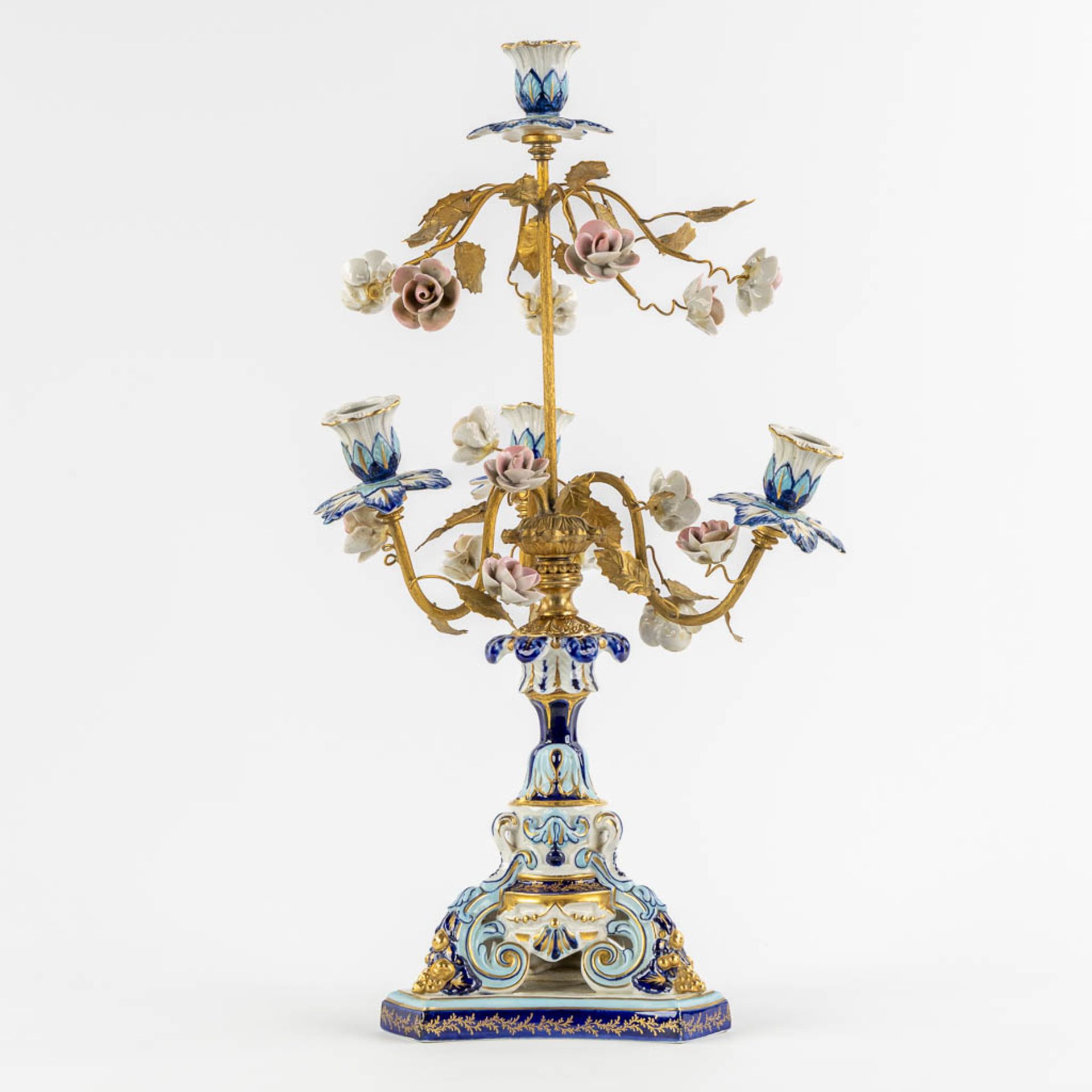 A candelabra, gilt brass and polychrome porcelain with flowers. Sèvres marks. (H:51 x D:24 cm)
