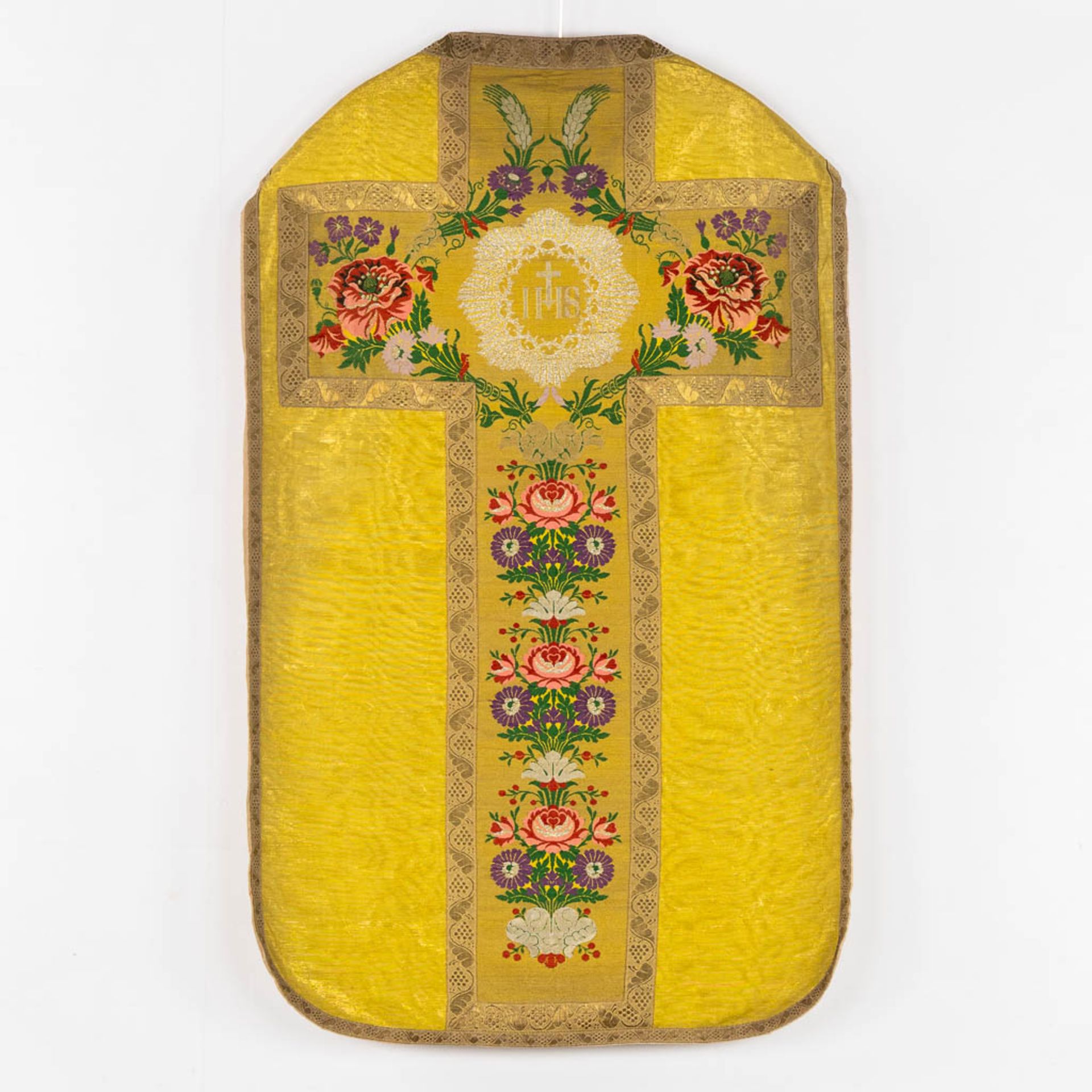 A Humeral Veil and Four Roman Chasubles, embroideries with an IHS and floral decor. - Image 8 of 29