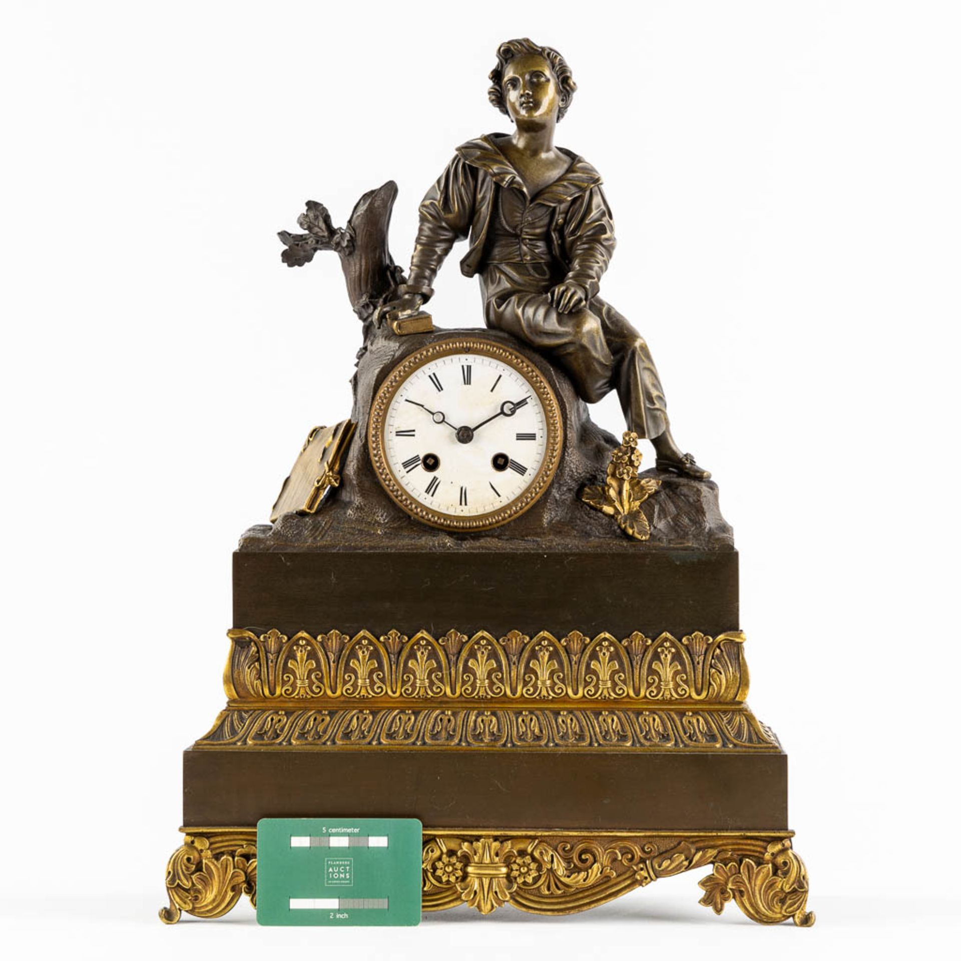A mantle clock, gilt and patinated bronze, Empire style. 19th C. (L:13 x W:34 x H:46 cm) - Image 2 of 9