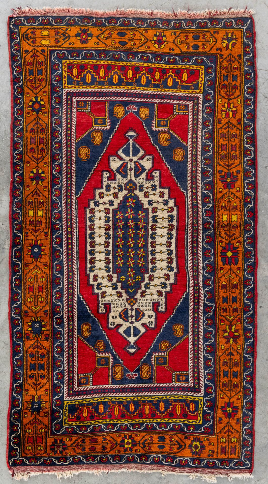 An Oriental hand-made carpet, probably Turkey, Anatolia. (L:236 x W:132 cm)