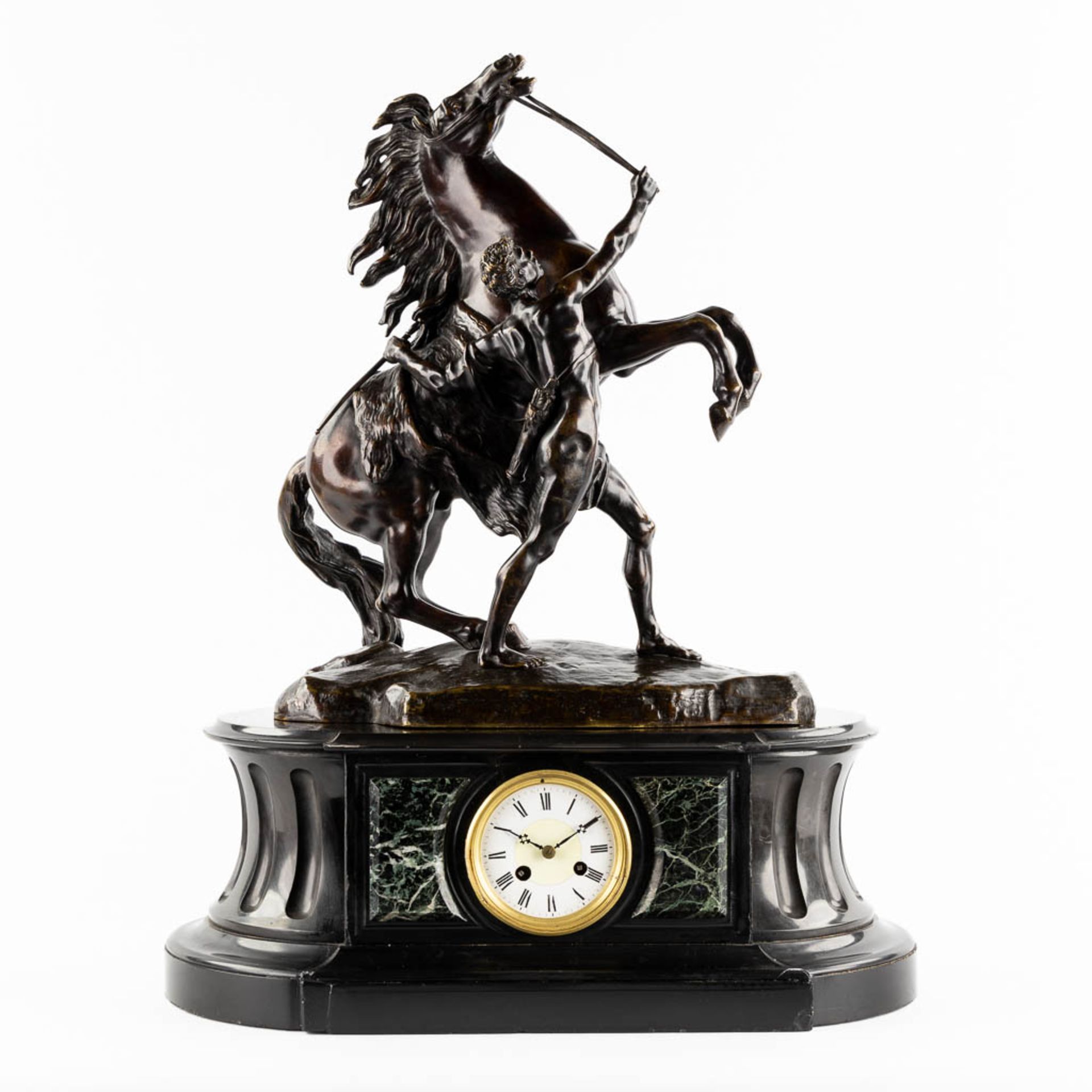 A Mantle clock, black marble mounted with a patinated bronze 'Marly Horse', 19th C. (L:29 x W:55 x H