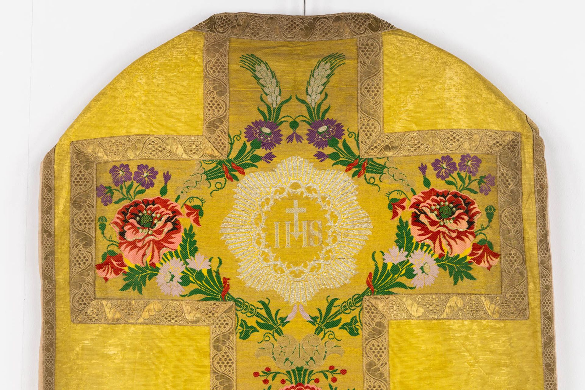 A Humeral Veil and Four Roman Chasubles, embroideries with an IHS and floral decor. - Image 9 of 29