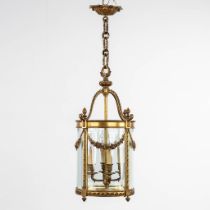 A lantern, brass and glass in Louis XVI style. (H:68 x D:37 cm)