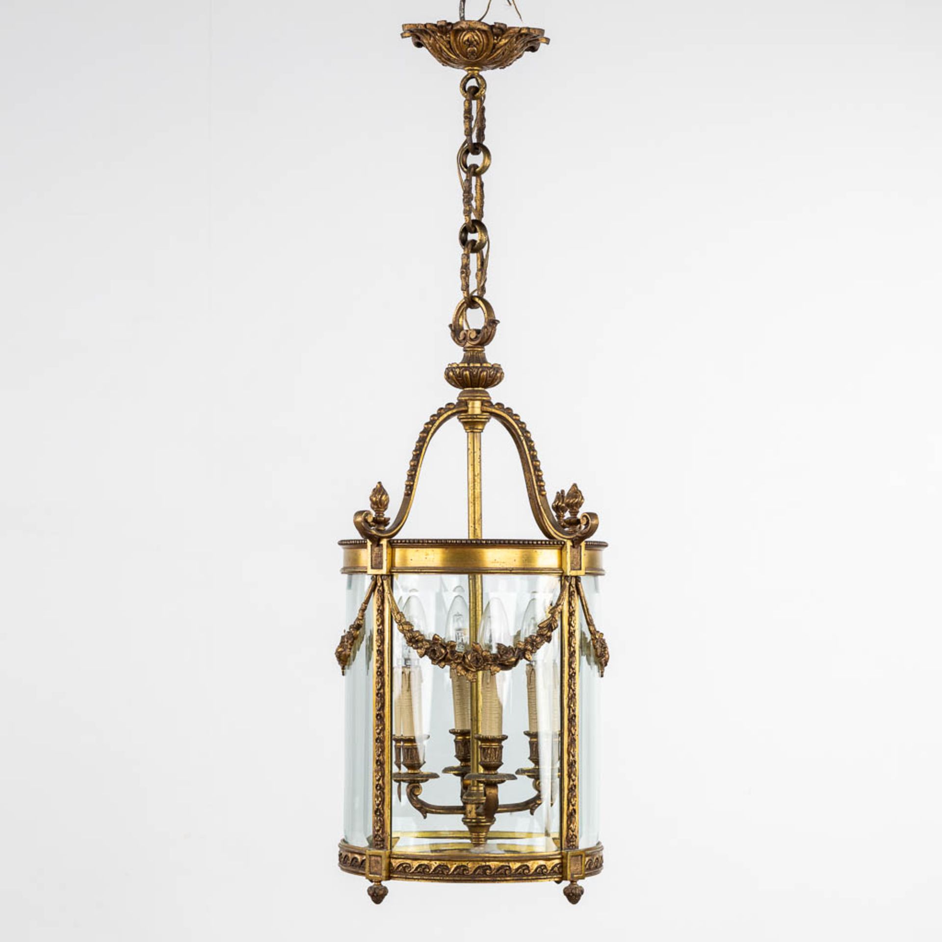 A lantern, brass and glass in Louis XVI style. (H:68 x D:37 cm)