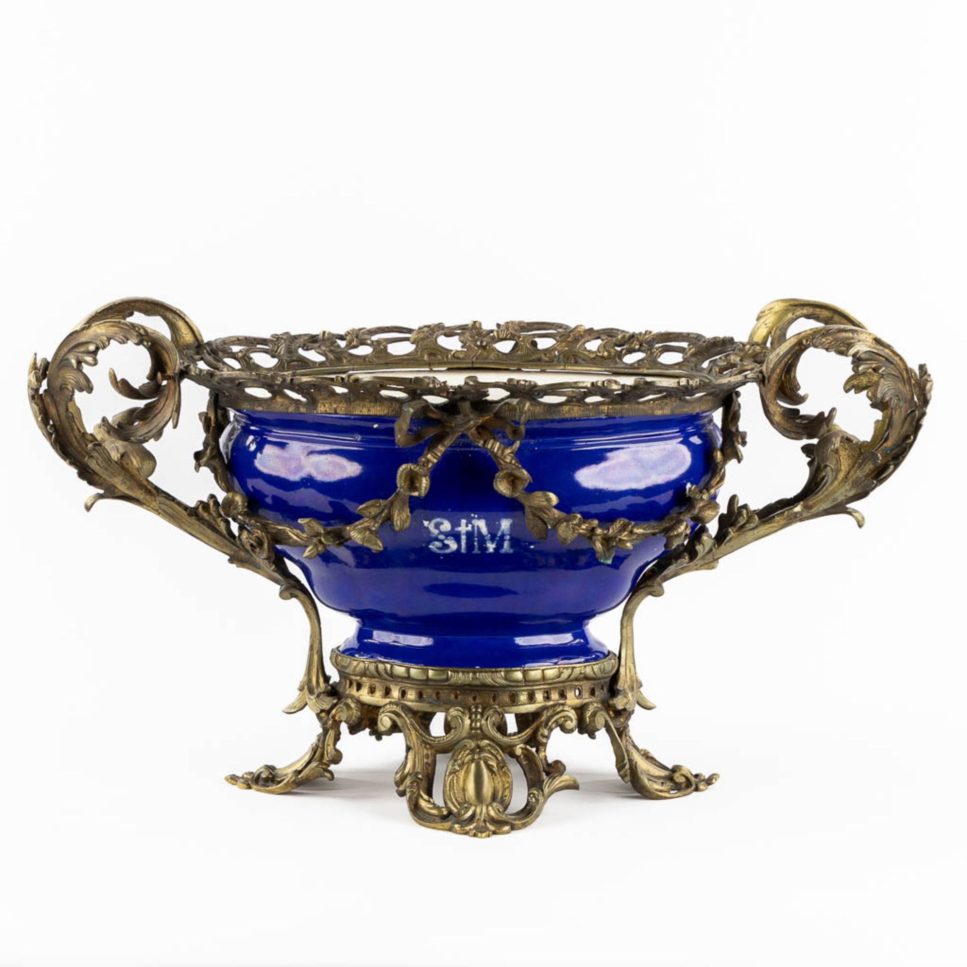 A large blue-glaze faience blowl mounted with bronze, 19th C. (L:31 x W:61 x H:34 cm)